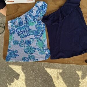 Lilly Pulitzer one shoulder shirts.